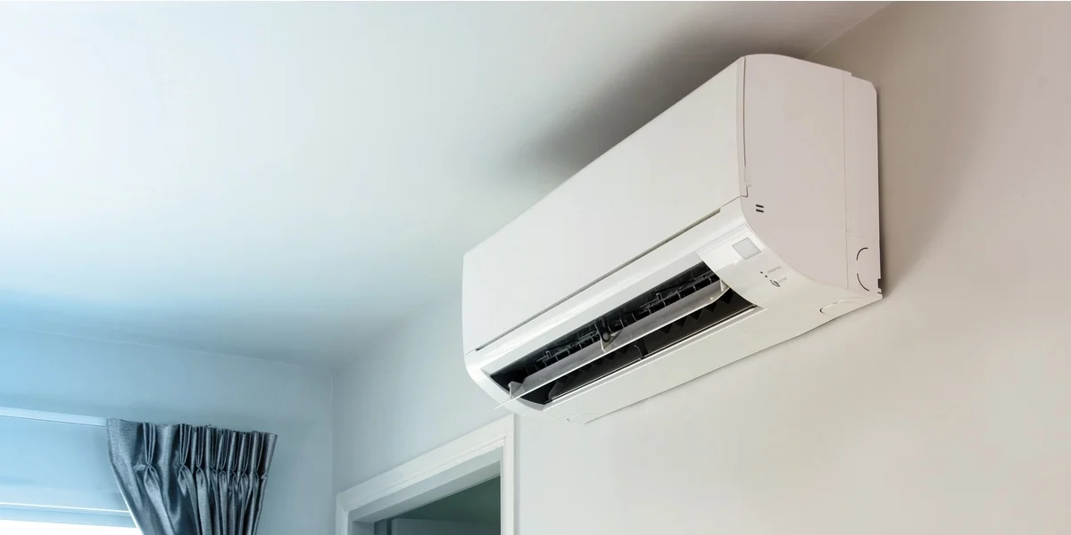 Mini split system hanging on a wall
